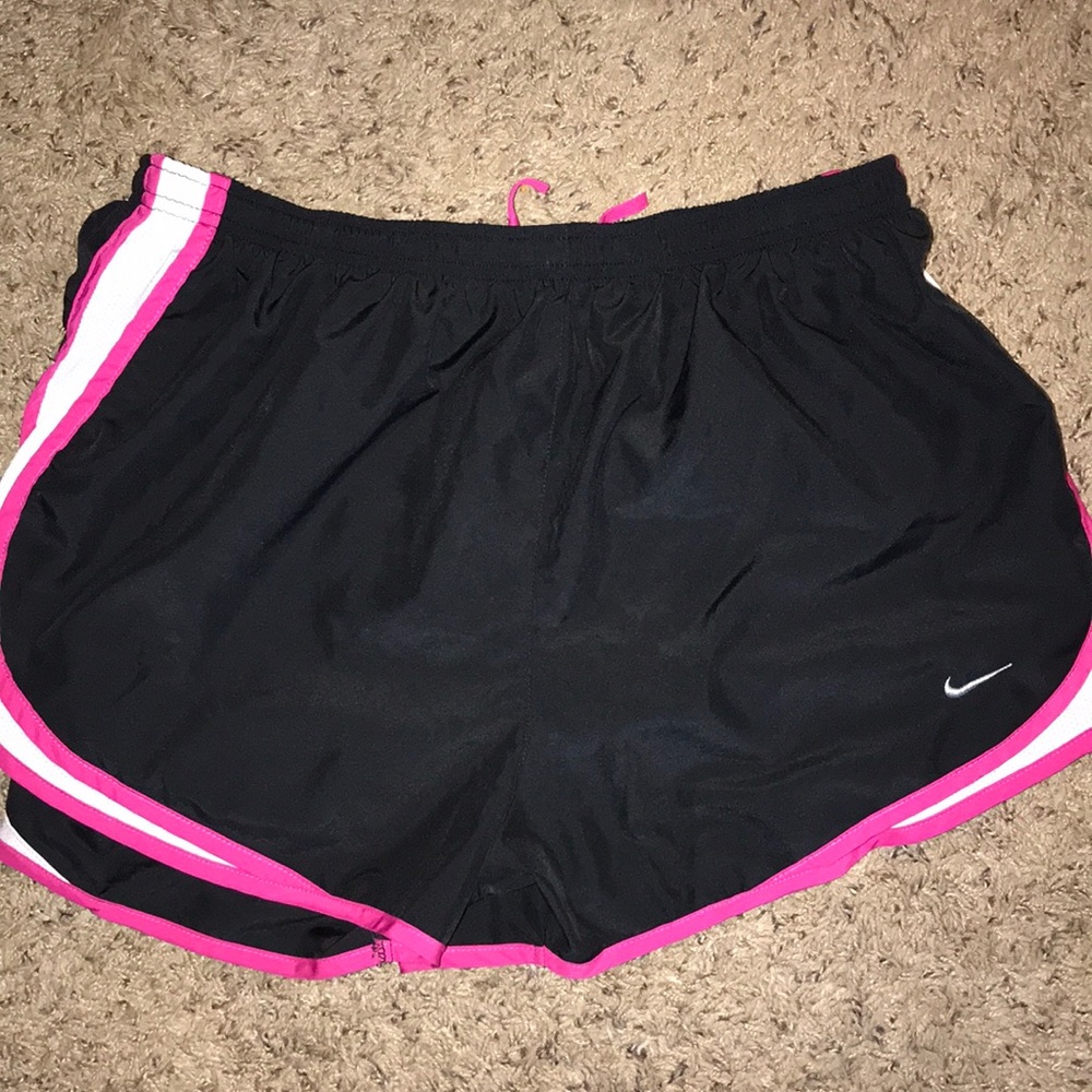 Black and pink nike women’s running shorts